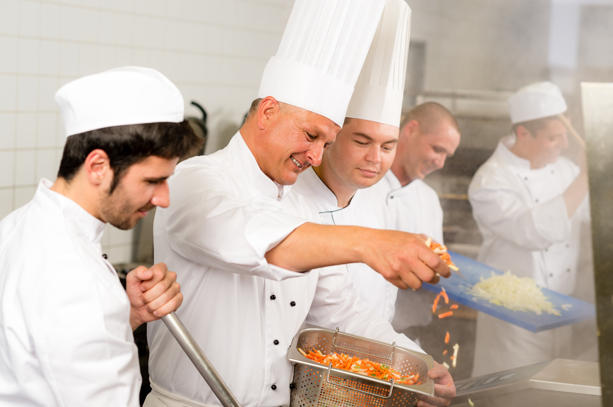 Professional kitchen happy chef prepare food meal international cuisine